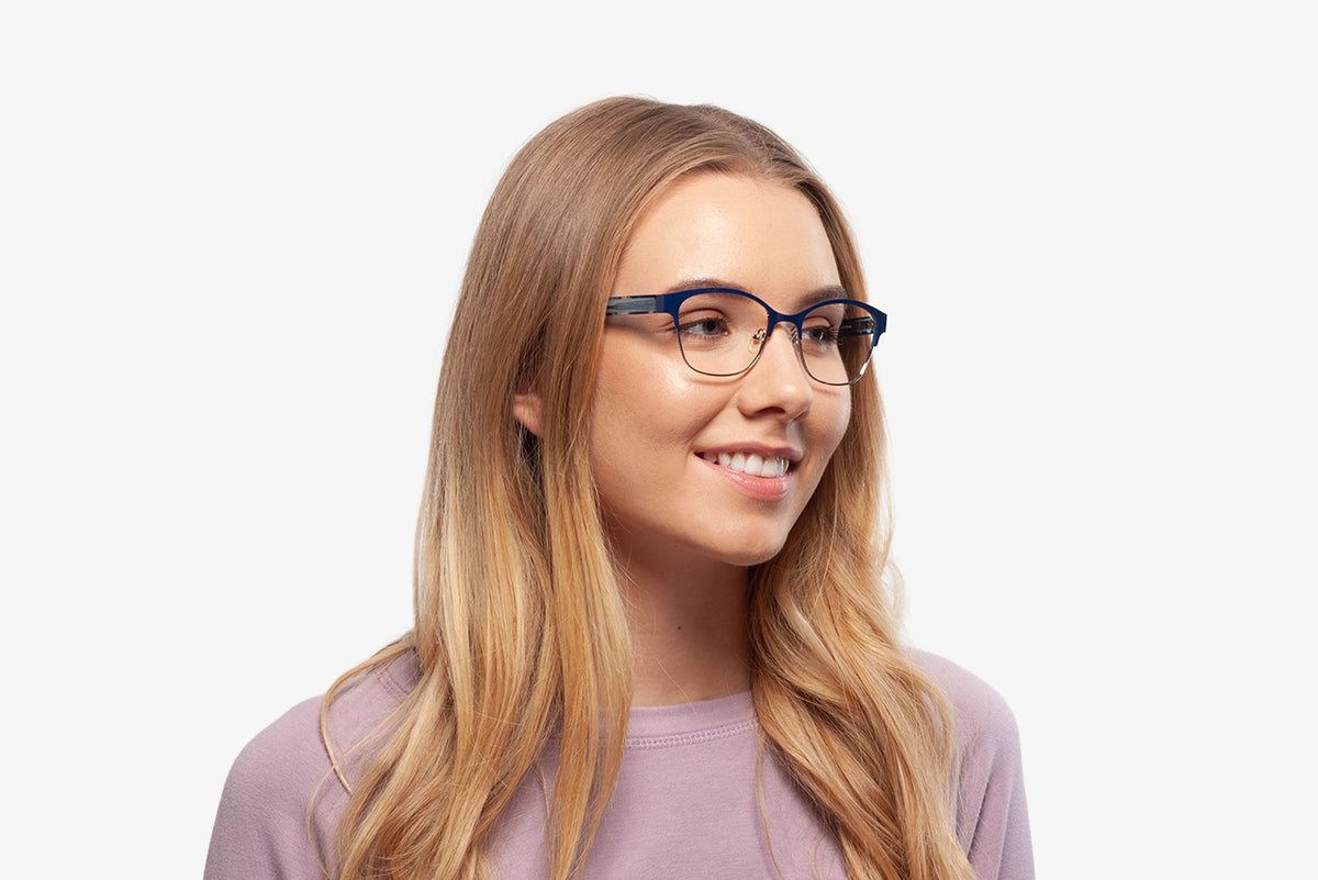 Blue Rebecca eyeglasses by Chemistrie worn by female model, side view