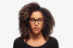 Black Allen eyeglasses by Chemistrie worn by female model, front view
