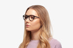 Black Allen eyeglasses by Chemistrie worn by female model, side view