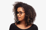 Black Allen eyeglasses by Chemistrie worn by female model, side view