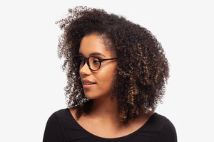 Black Allen eyeglasses by Chemistrie worn by female model, side view