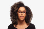 Purple Allison eyeglasses by Chemistrie worn by female model, front view