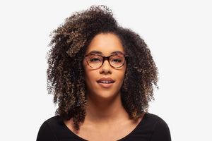 Purple Allison eyeglasses by Chemistrie worn by female model, front view