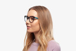 Blue Stripe Amy eyeglasses by Chemistrie worn by female model, side view