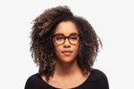 Emerald Tortoise Amy eyeglasses by Chemistrie worn by female model, front view