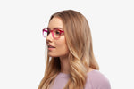 Pink Bravo eyeglasses by Chemistrie worn by female model, front view