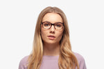 Emerald Tortoise eyeglasses by Chemistrie worn by female model, front view