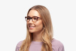 Emerald Tortoise eyeglasses by Chemistrie worn by female model, side view