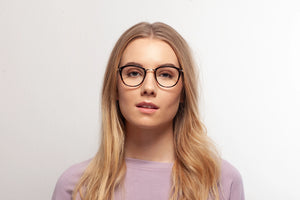 Tortoise Casey eyeglasses by Chemistrie worn by female model, front view