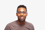 Blue Charlie eyeglasses by Chemistrie worn by male model, front view