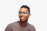 Blue Charlie eyeglasses by Chemistrie worn by male model, side view