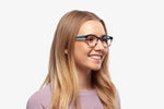 Blue Stripe Chriss eyeglasses by Chemistrie worn by female model, side view