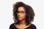 Grey Stripe Chriss eyeglasses by Chemistrie worn by female model, side view