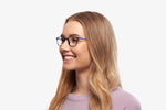 Blue Deborah eyeglasses by Chemistrie worn by female model, side view