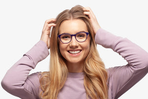 Blue Grace eyeglasses by Chemistrie worn by female model, front view