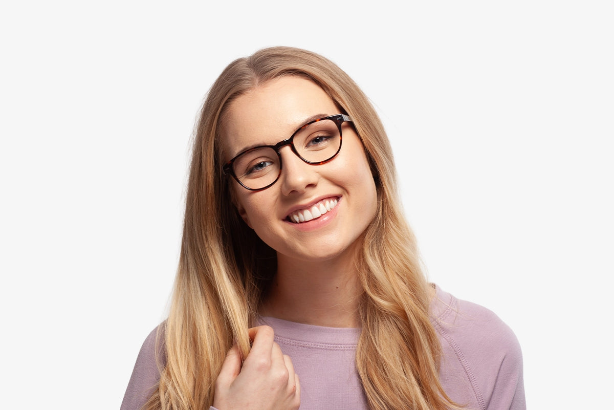 Tortoise Grace eyeglasses by Chemistrie worn by female model, front view