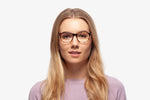 Blue Tortoise Harper eyeglasses by Chemistrie worn by female model, front view