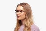 Blue Tortoise Harper eyeglasses by Chemistrie worn by female model, side view