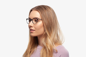 Blue Julia eyeglasses by Chemistrie worn by female model, side view