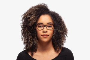 Green Julia eyeglasses by Chemistrie worn by female model, front view