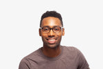 Manny Grey Stripe eyeglasses by Chemistrie worn by male model, front view