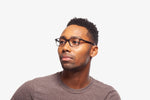 Manny Grey Stripe eyeglasses by Chemistrie worn by male model, side view