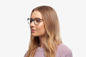 Blue Margot eyeglasses by Chemistrie worn by female model, side view