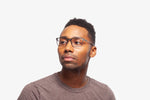 Gunmetal Mark eyeglasses by Chemistrie worn by male model, front view