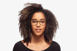 Green Tortoise Modena eyeglasses by Chemistrie worn by female model, front view