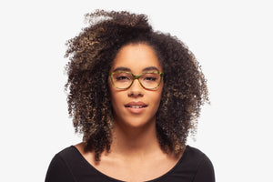 Green Tortoise Modena eyeglasses by Chemistrie worn by female model, front view