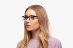 Black Nicky eyeglasses by Chemistrie worn by female model, side view