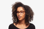 Snow Leopard Robin eyeglasses by Chemistrie worn by female model, front view