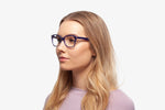 Deep Blue Robin eyeglasses by Chemistrie worn by female model, side view