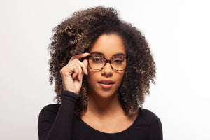 Snow Leopard Robin eyeglasses by Chemistrie worn by female model, front view