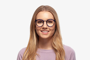 Blue Stacey eyeglasses by Chemistrie worn by female model, font view