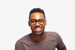 Black Tanner eyeglasses by Chemistrie worn by male model, front view