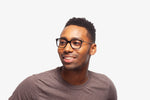 Black Tanner eyeglasses by Chemistrie worn by male model, side view