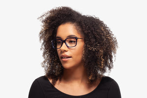 Blue Tanner eyeglasses by Chemistrie worn by female model, side view