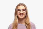 Blue Taylor eyeglasses by Chemistrie worn by female model, front view