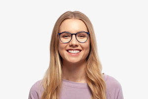 Blue Taylor eyeglasses by Chemistrie worn by female model, front view