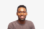 Amber Tortoise Thomas eyeglasses by Chemistrie worn by male model, front view