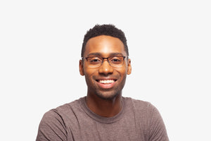 Amber Tortoise Thomas eyeglasses by Chemistrie worn by male model, front view