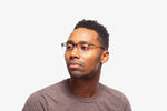 Amber Tortoise Thomas eyeglasses by Chemistrie worn by male model, side view