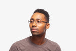 Gunmetal Troy eyeglasses by Chemistrie worn by male model, side view