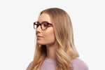 Tortoise Venice eyeglasses by Chemistrie worn by female model, side view